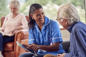 local caregiver careers | caregiver talking to elderly woman