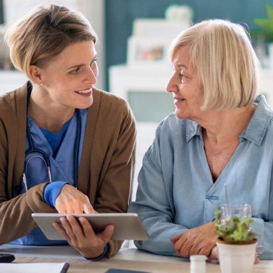 caregiver-with-senior-woman-patient