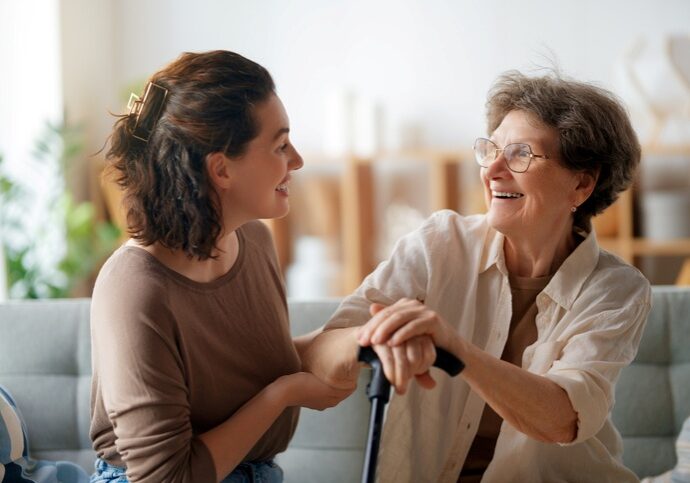 Adult daughter checking in with her aging mother at home, a sign it may be time for in-home care